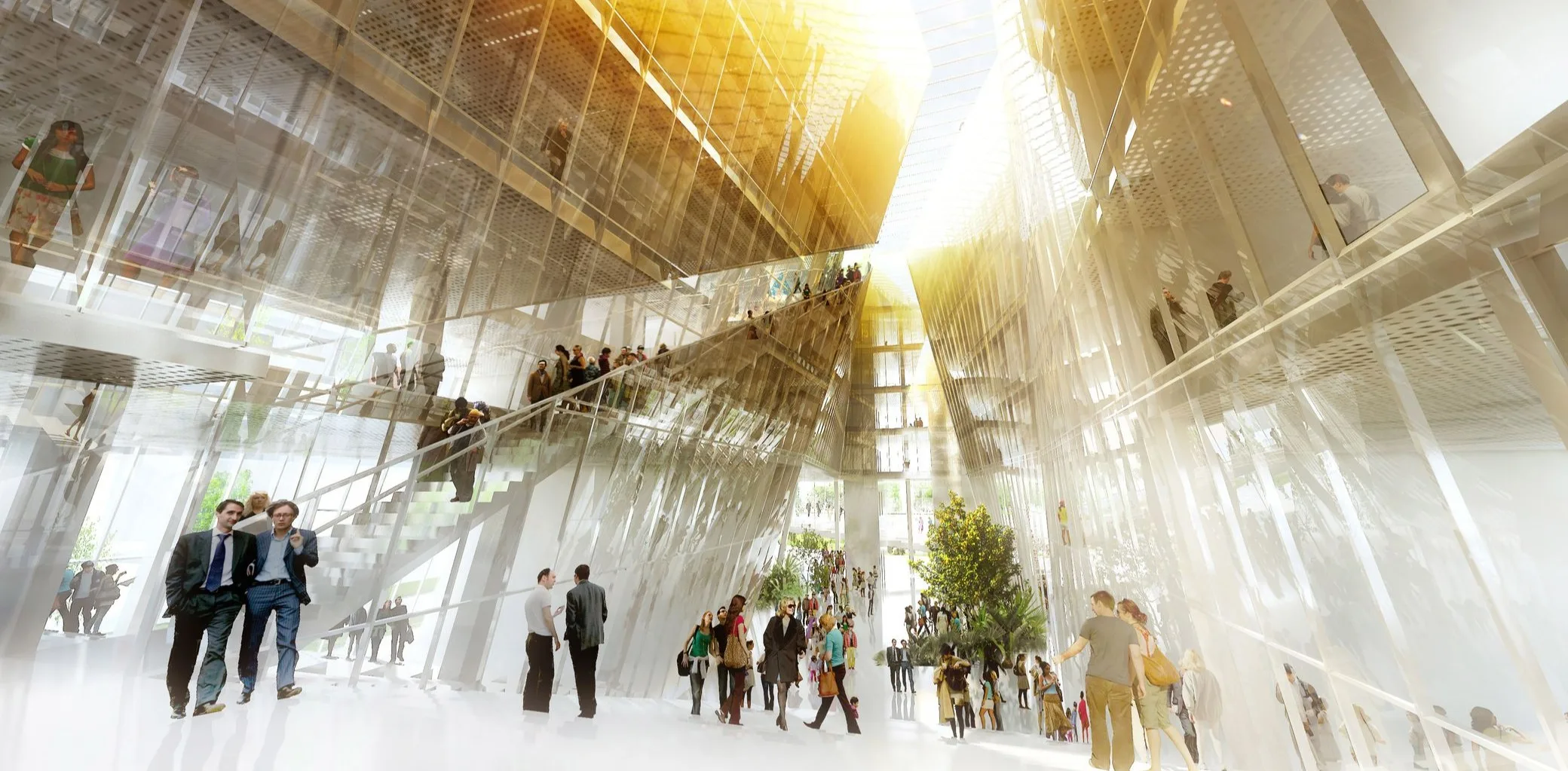 L’atrium de la Cité de l’Innovation vu depuis le sol : les parois du vide central montent en biais de part et d’autre, la lumière descend par la fente qui les sépare, des escaliers et des passerelles franchissent le vide et des arbres sont plantés au niveau bas.